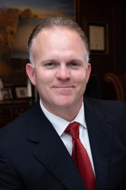 Portrait of Dallas criminal defense attorney Richard McConathy in his office